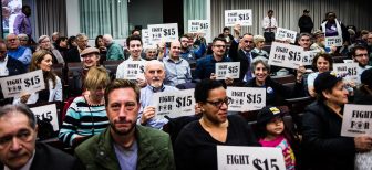 jufj-cover-image-3 fight for 15 activists holding signs