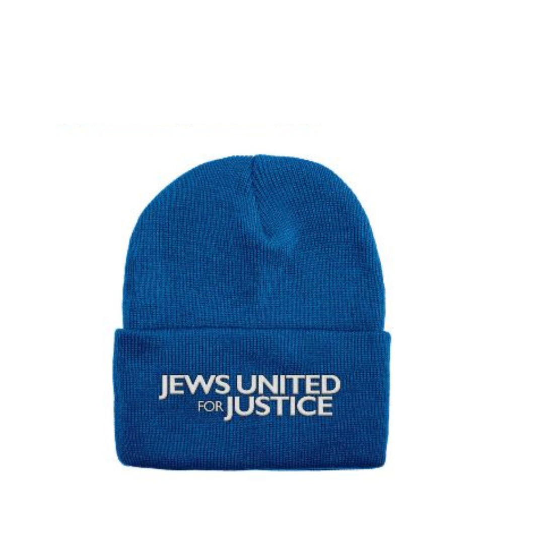 A blue knit cap with Jews United for Justice embroidered on it